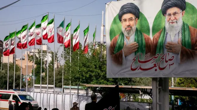 Iranians gather outside the Imam Khomeini Mosalla Mosque during an event to commemorate those killed in the current US-Israeli wa