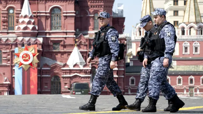  Russian National Guard officers walk across Red Square decorated for the Victory Day military parade in Moscow, Russia, on May 6, 2026.