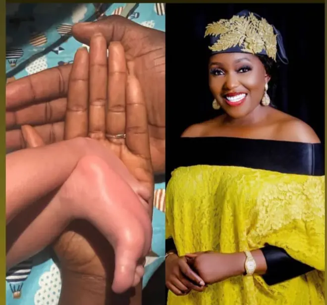 aworan Biola Bayo ati ẹsẹ ọmọ tuntun jojolo rẹ 