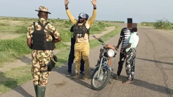 Nigerian Army tok say ISWAP Chief finance officer and im two son don surrender to di Nigerian Army