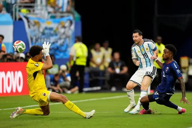 Lionel Messi of Argentina scores di team first goal, Vozinha of Cape Verde, Diney of Cape Verde during di Round Of 32 - FIFA World Cup 2026 match between Argentina and Cabo Verde for di Miami Stadium on July 3, 2026 for Miami Gardens, Florida