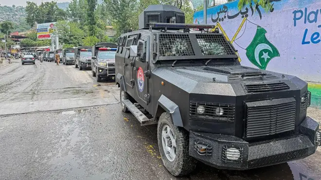 A convoy of police vehicles parked along a street of Muzaffarabad, the capital of Pakistan-administered Kashmir, on June 12, 2026 during a protest called by the Joint Awami Action Committee (JAAC)