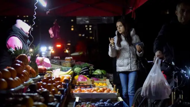 Kyiv resident at night market 