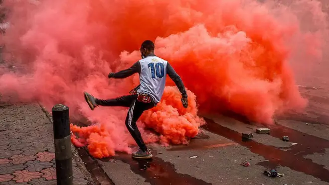 Demonstrator kick burning teargas cannister during di protest by youths many wey say dem be 'Gen-Z', on June 25, 2025 for Nairobi, Kenya
