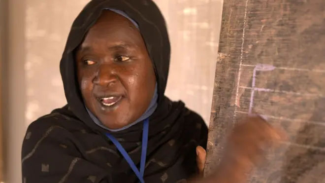 Hanan at a blackboard