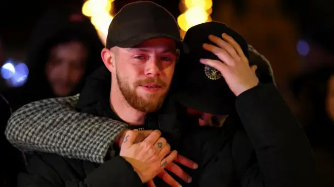 People react outside the "Le Constellation" bar