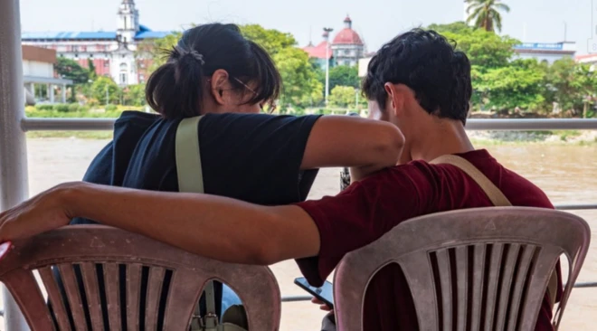 Man and women facing away from the camera