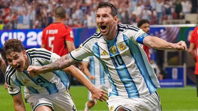 Lionel Messi, Julian Alvarez and Enzo Fernandez celebrate after a goal against Egypt