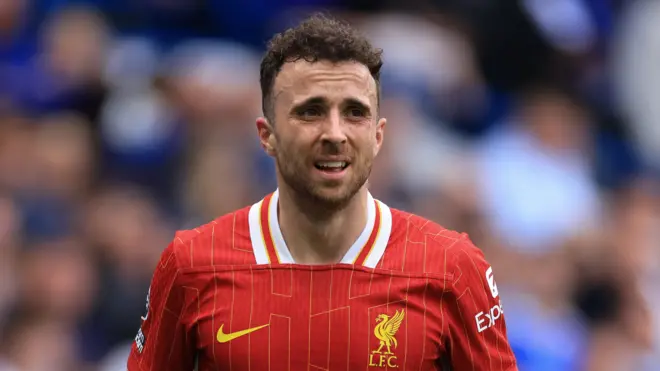 Diogo Jota wearing Liverpool's red home kit