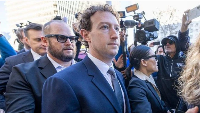 Mark Zuckerberg arrives at court in LA wearing a dark blue suit jacket, white shirt and grey tie