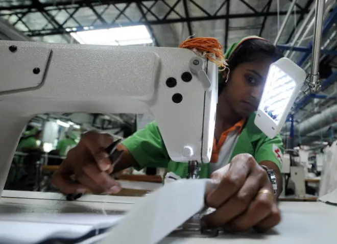 In this picture taken on November 24, 2008, Sri Lankan garment workers manufacture items for British retailer Marks and Spencers at a factory in Seeduwa , some 30kms north of Colombo. Sri Lanka's clothing exporters are joining the 'green' race by investing millions of dollars to upgrade factories and curry favour with foreign consumers who are environment-conscious