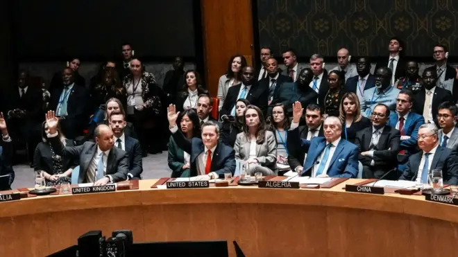 Members of the UN Security Council raise their hands while voting on the US-backed proposal for Gaza.