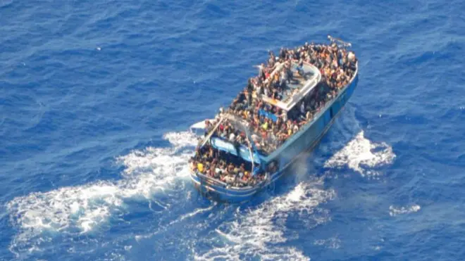 A undated handout photo provided by the Greek Coast Guard shows migrants onboard a boat during a rescue operation before their boat capsized on the open sea, off Greece, June 14, 2023