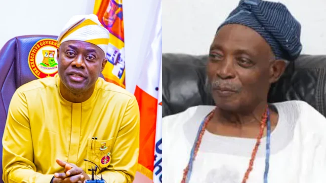 Gómìnà Seyi Makinde sọ aṣọ aláwọ̀ èsúrú, ó ń wo ọ̀ọ́kán, Olubadan ilẹ̀ Ibadan, Ọba Rashidi Ladoja wọ aṣọ funfun ni apá ọ̀tún, ó kó ilẹ̀kẹ̀ sọ̀rùn, ó ń wo ẹ̀gbẹ́