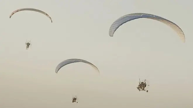 Hamas's Al-Qassam Brigades released this image of its fighters parachuting into Israel