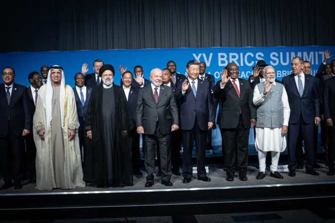 South African President Cyril Ramaphosa with fellow Brics leaders President of Brazil Luiz Inacio Lula da Silva, President of China Xi Jinping, Prime Minister of India Narendra Modi, and Russia's Foreign Minister Sergei Lavrov pose for a family photo, with delegates including six nations invited to join the Brics group, Argentina, Egypt, Ethiopia, Iran, the United Arab Emirates and Saudi Arabia, during the closing day of The Brics summit at the Sandton Convention Center on 24 August, 2023 in the Sandton district of Johannesburg, South Africa. 