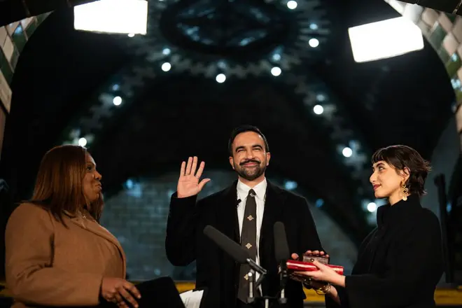 Letitia James, New York's attorney general, from left, Zohran Mamdani, mayor of New York, and his wife Rama Duwaji during a swearing-in ceremony at Old City Hall Station in New York, US, early on Thursday, Jan. 1, 2026. 