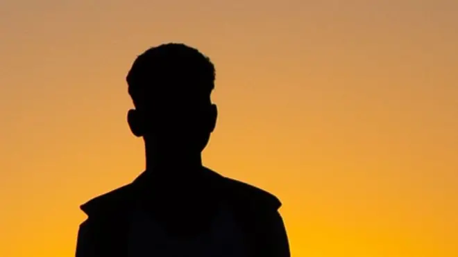 One silhouette of anonymous African man