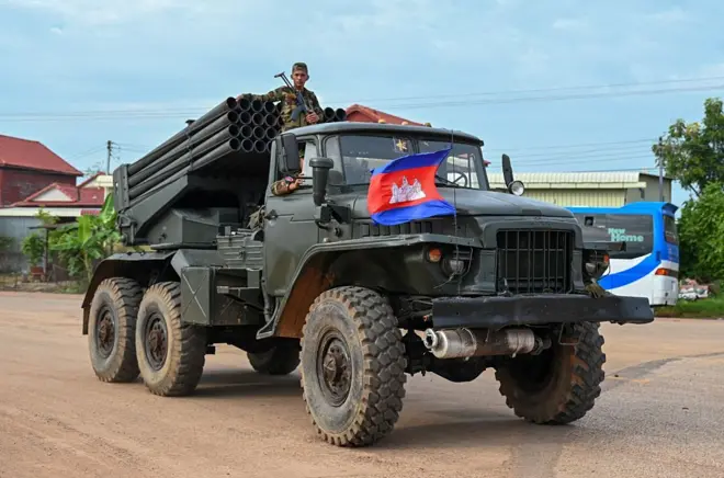 A Cambodian soldier stands on a truck carrying a Russian-made BM-21 rocket launcher travelling along a street in Oddar Meanchey province on July 25, 2025. Thailand and Cambodia fought their bloodiest military clashes in more than a decade on July 24, with at least 12 people killed as the two sides battled with tanks, artillery and ground forces over a disputed border zone. (Photo by TANG CHHIN Sothy / AFP) (Photo by TANG CHHIN SOTHY/AFP via Getty Images)