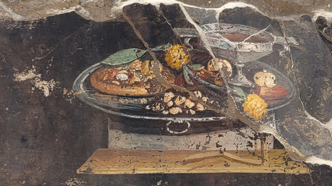 Un fresco antiguo en el que se ve un antecesor de la pizza