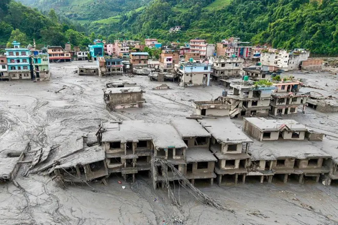 TOPSHOT-NEPAL-WEATHER-LANDSLIDE-FLOODS
TOPSHOT - An aerial view shows houses lying deluged in sludge after flash floods at Devighat, Bidur Municipality in Nepal's Nuwakot district on August 27, 2026. Nepal's disaster agency said that 823 people remained out of contact on August 27, more than 24 hours after a deadly flood tore through the border region with Tibet. (Photo by Prabin RANABHAT / AFP via Getty Images