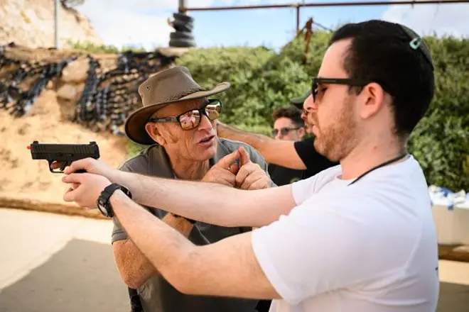 Israeli citizens take to the shooting range for pratice