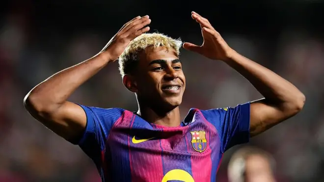 Lamine Yamal makes a crown gesture above his head after scoring