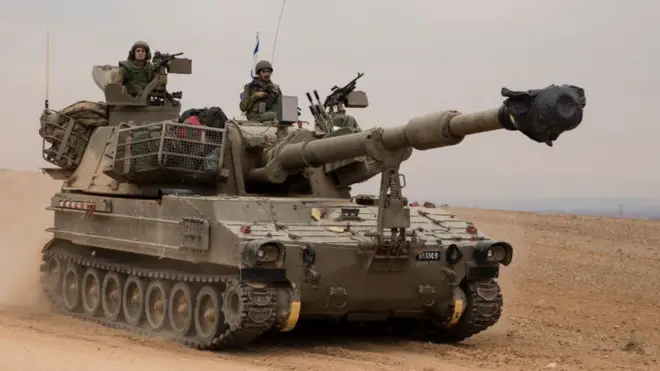 An Israeli tank drives toward the Israeli southern border with the Gaza Strip on October 9, 2023 near Sderot, Israel