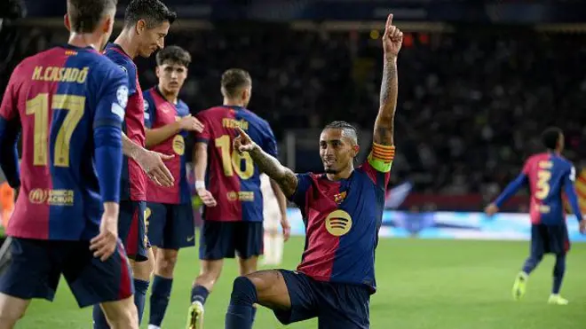 Barcelona Brazilian forward Raphinha celebrate as im score im third goal during di UEFA Champions League, matchday 3 football match between FC Barcelona and FC Bayern Munich. for di Estadi Olimpic Lluis Companys for Barcelona on October 23, 2024.