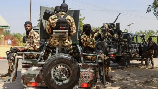 Army officials on armoured tanks
