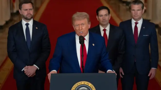 Trump addresses the nation on Saturday night to inform them of the US air strikes on Iranian nuclear facilities, dressed in a blue suit and red tie and flanked by JD Vance, Marco Rubio and Pete Hegseth
