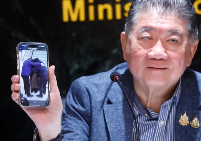 Thai Defense Minister Phumtham Wechayachai shows a picture on his mobile phone of Uyghur refugees upon their arrival at a airport in China, during a press conference on the deportation of Uyghur refugees detained in Thailand to China, at the Justice Ministry in Bangkok, Thailand, 27 February 2025. Thai authorities stated the deportation of 40 Uyghur refugees detained in Thailand to China, was done under human rights principles. International human rights organizations and activists warn that approximately 48 Uyghur refugees, detained in Thailand since fleeing China in 2014 are at risk of deportation and face potential persecution if returned.
Thai authorities issue statement on deportation of Uyghur refugees detained in Thailand to China, Bangkok - 27 Feb 2025