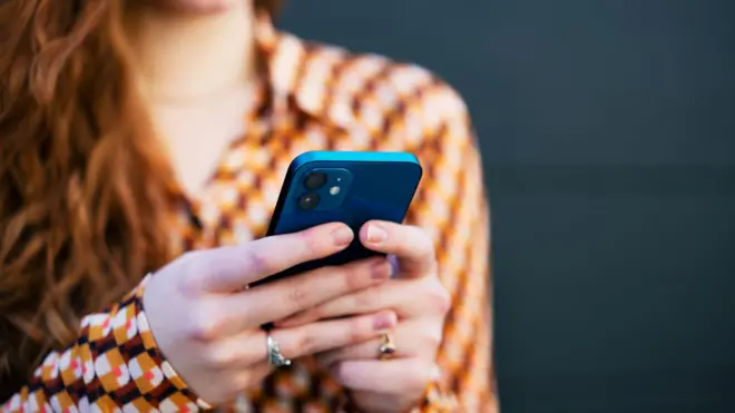 One pesin hold phone