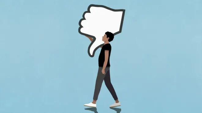 Cartoon man carries a large cutout of a thumbs-down emoji