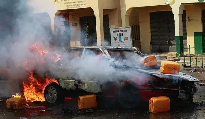 A car is on fire after a suicide bombing which was staged by a suspected female suicide bomber near a campaign rally at Pantami Stadium attended by President Goodluck Jonathan and also killed at least five people and injured 8 others in Gombe, Nigeria on February 02, 2015.