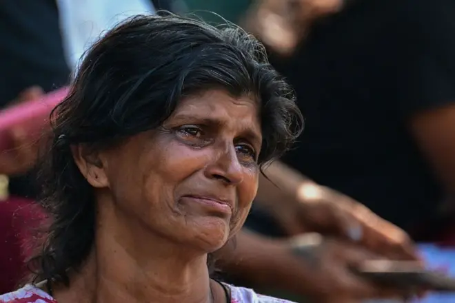 SRI LANKA-PRISON-RIOT A relative of a victim killed in clashes between inmates of two drug gangs, grieves in front of the Negombo prison on the outskirts of Colombo on July 7, 2026. Clashes in a Sri Lankan jail have killed 23 people, including four guards, and wounded more than 100 in the country's deadliest prison riot in more than five years, officials said on July 6. (Photo by Ishara S. KODIKARA / AFP via Getty Images)