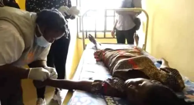 Health worker with cholera patient 