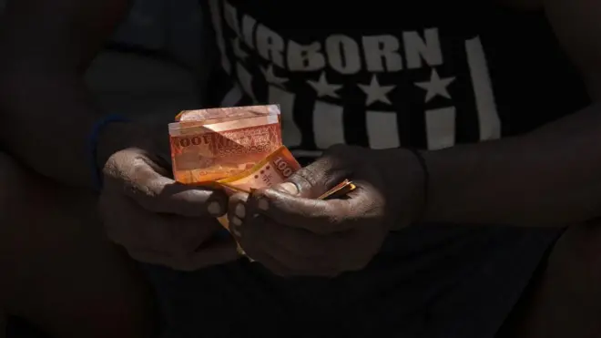 Sri Lankan man with money in his hand