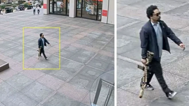 CCTV images capture di gunman dey waka along New York street for broad daylight as e carry large weapon