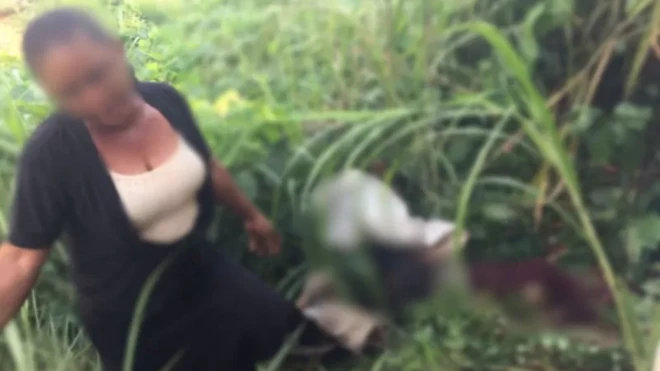 Madam Chinelo stand beside di bag wia she hide her grandson body