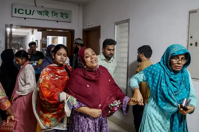 A woman weeps in the hospital