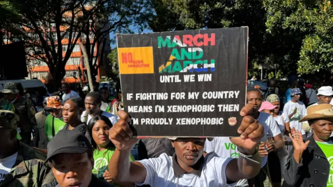 One man carry placard up as demonstrators march for Pretoria South Africa