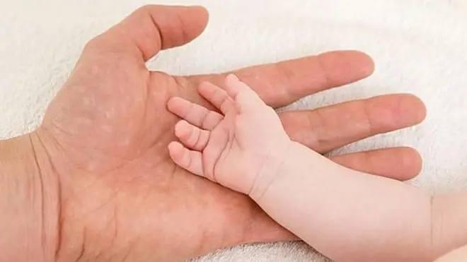 Father's and baby's hands