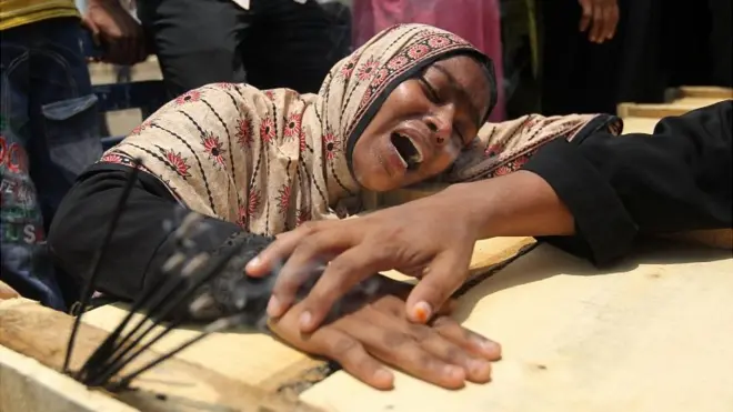 Woman grieves over relative lost in Dhaka building collapse. 9 May 2013