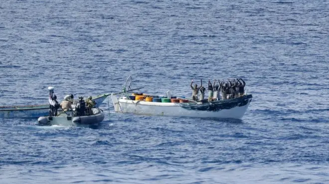 HMAS Melbourne's boarding team approach a group of suspected pirates after tracing them 500 nautical miles from the Somali coast.
