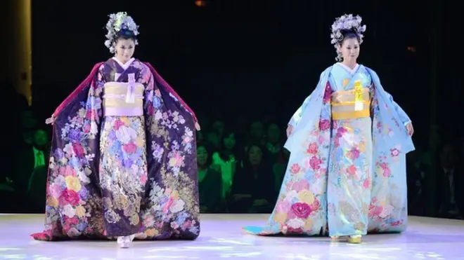 Models wearing bridal kimonos at a fashion show in Japan