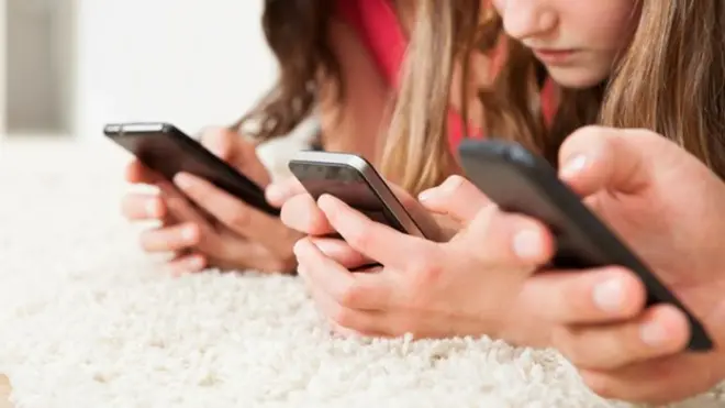 Children using mobile phones