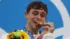 Tom Daley of Team Great Britain poses with the gold medal for the Men's Synchronised 10m Platform Final