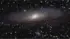 A photo of Andromeda galaxy with a tilt shift effect making the galaxy appear close