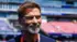 Ảnh cận cảnh phần đầu và vai của Jurgen Klopp, với mái tóc màu nâu, bộ râu bạc